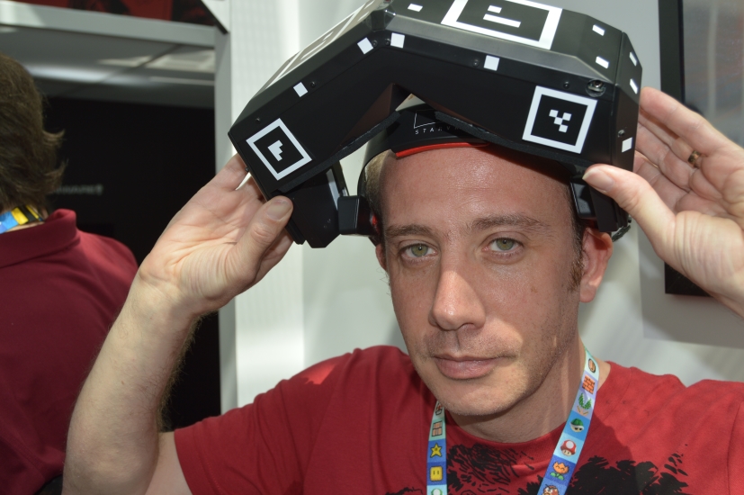 Lead VR Product Designer, Guillaume Gouraud, shows off the flippible nature of the StarVR headset