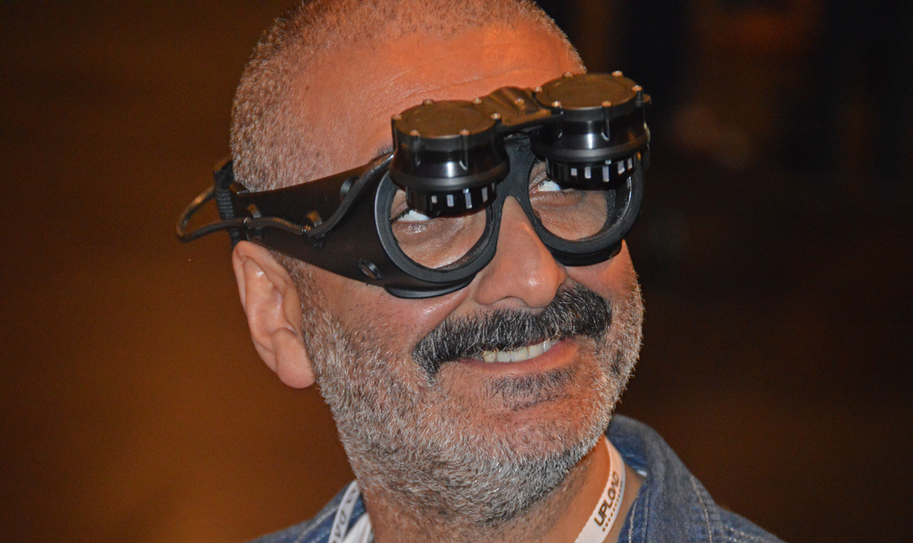 Demonstrating the headset's flip up lenses.